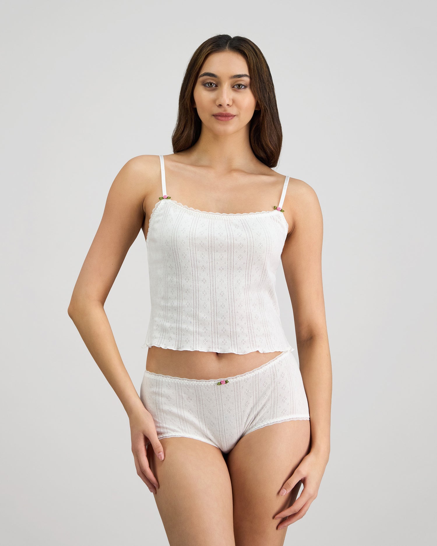 Model wears Body Cocoon Camisole in WHITE. On body front view