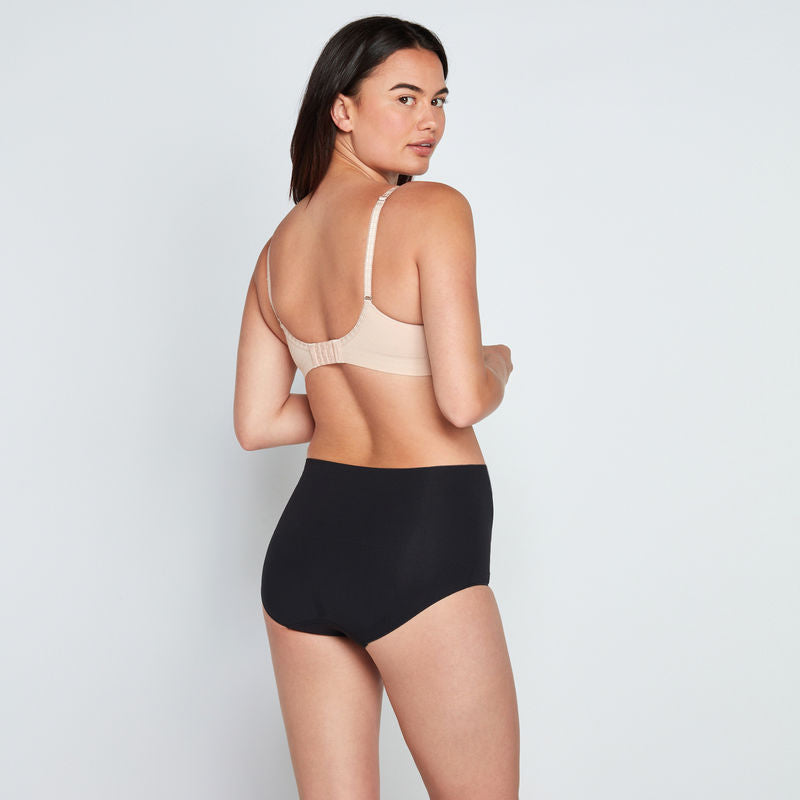 Model wears Medium Control Full Brief in BLACK. On body back view