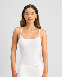Model wears Simply Seamless Camisole in WHITE. On body front view