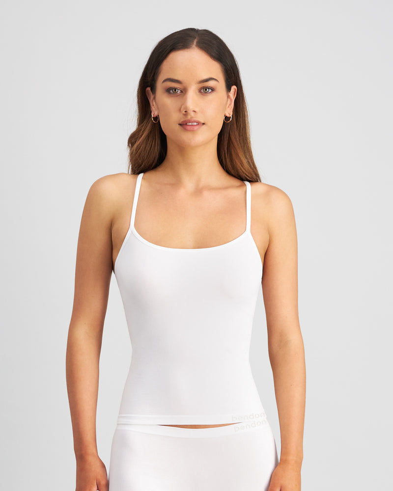 Model wears Simply Seamless Camisole in WHITE. On body front view