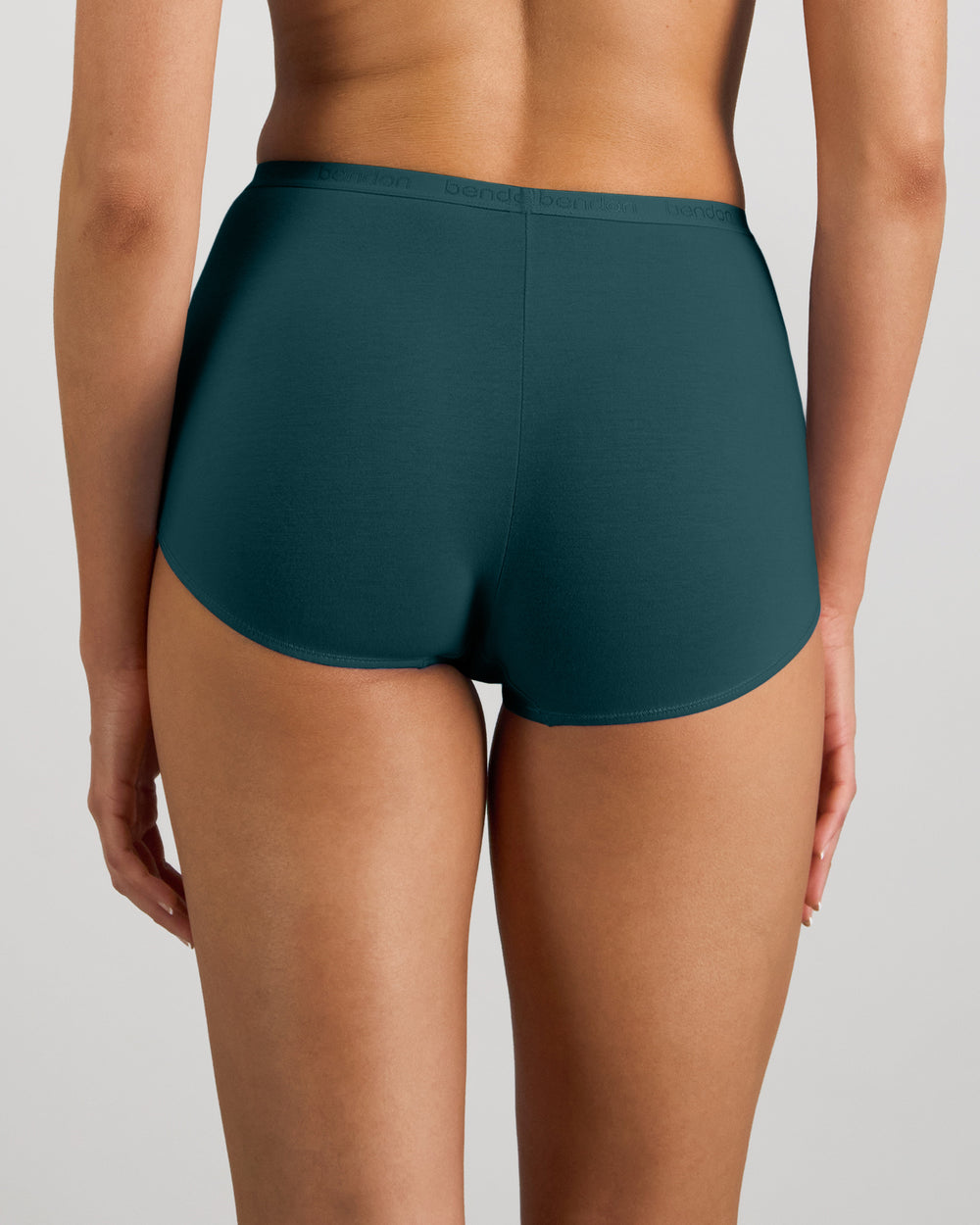 Model wears Body Cotton Full Brief in MEDITERRANEA. On body back view