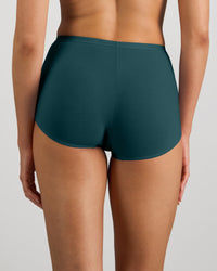 Model wears Body Cotton Full Brief in MEDITERRANEA. On body back view