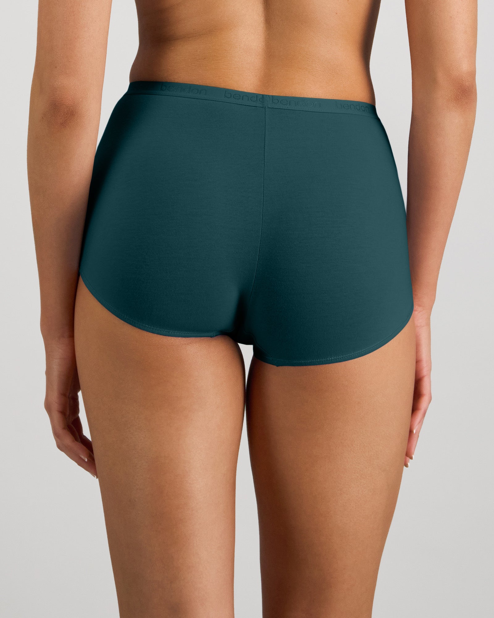 Model wears Body Cotton Full Brief in MEDITERRANEA. On body back view