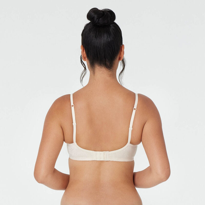 Model wears Yvette Underwire Bra in NATURAL. On body back view