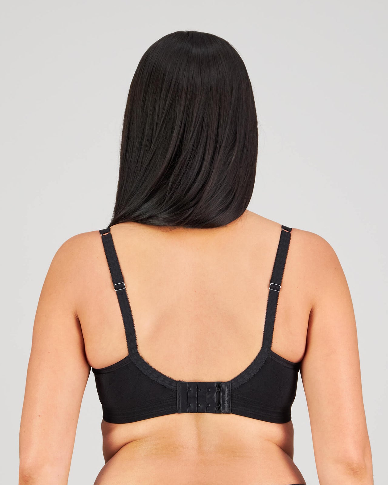 Model wears Bendon Body Contour Bra in BLACK. On body back view