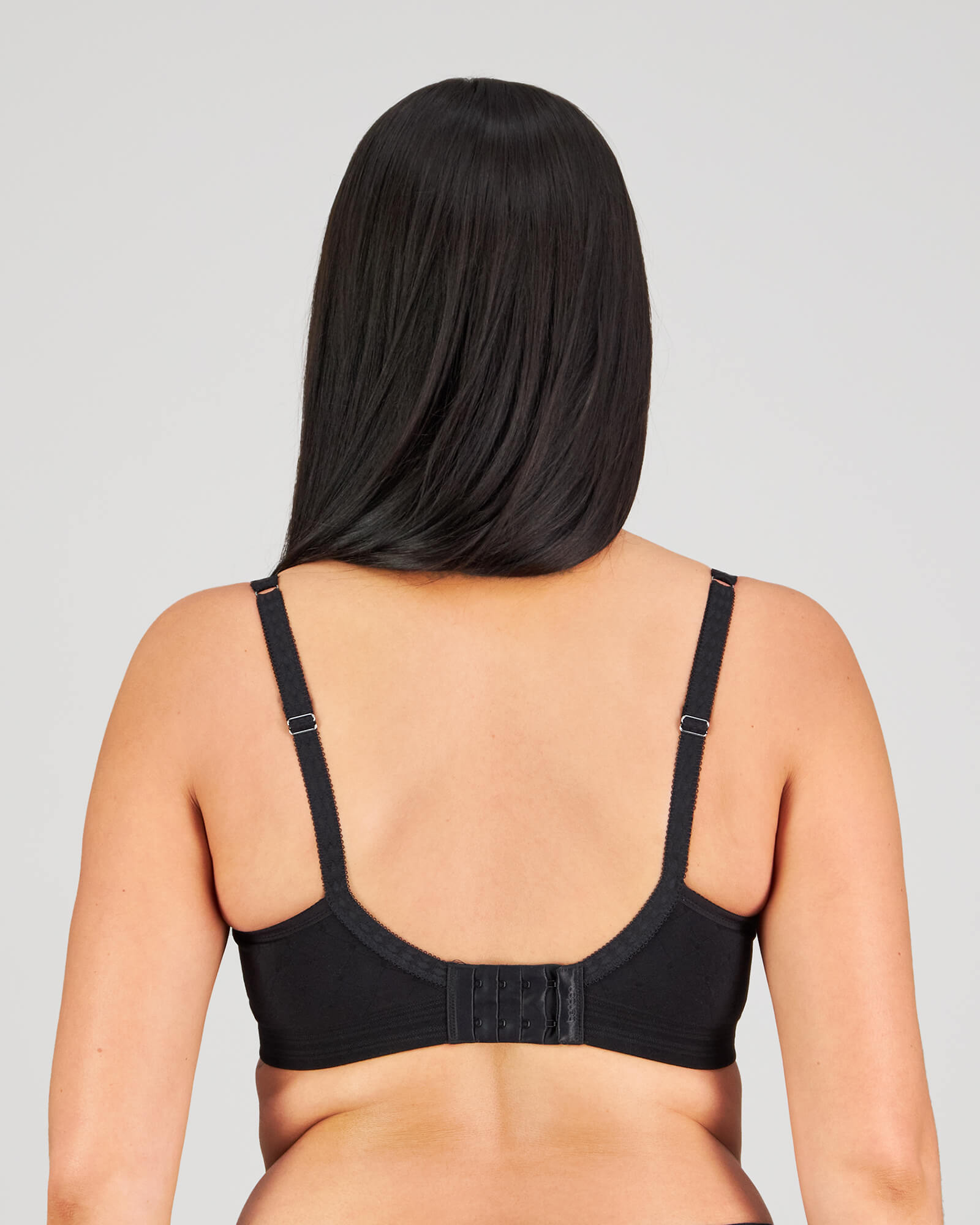 Model wears Bendon Body Contour Bra in BLACK. On body back view