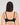 Model wears Bendon Body Contour Bra in BLACK. On body back view