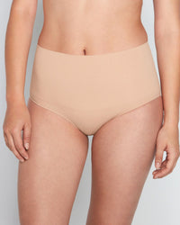 Model wears Bamboo Bodywear Full Brief in CARAMEL. On body front view