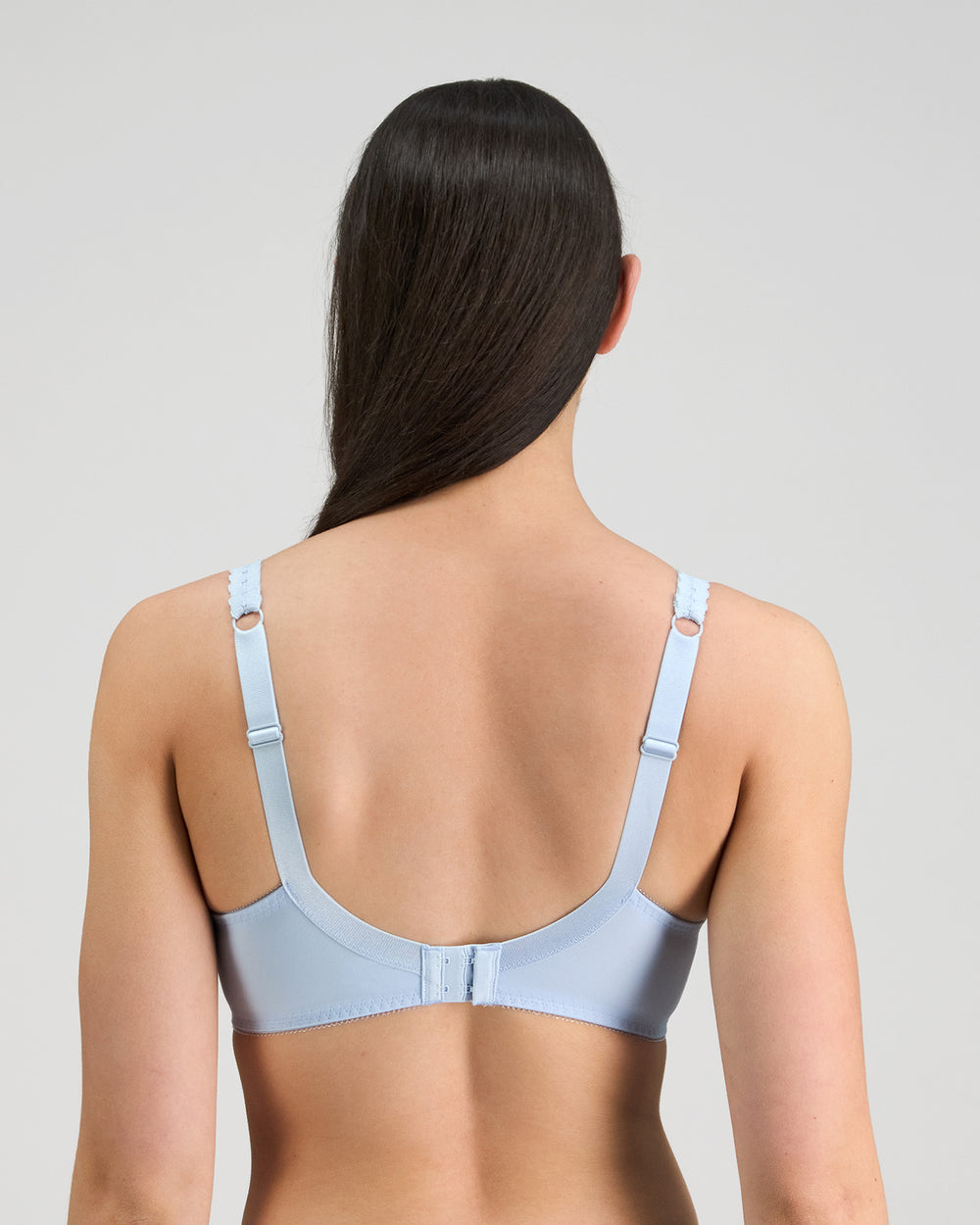 Model wears Coral Underwire Bra in SKYWAY. On body back view