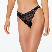 Model wears Sundown High Cut Brief in BLACK. On body front view
