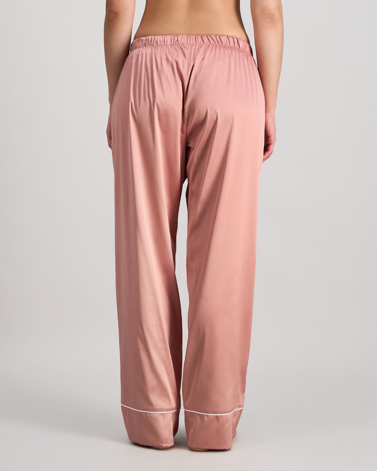 Model wears Holly Long PJ Pant in ASH ROSE. On body back view