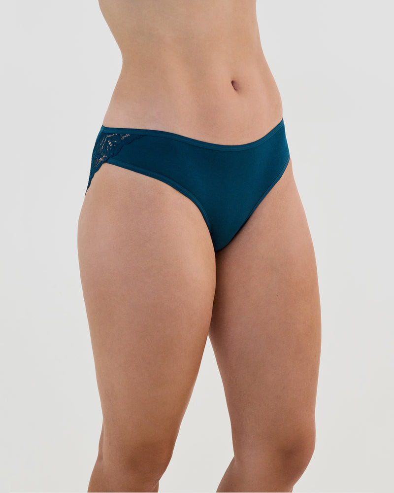 Model wears Cotton And Lace Bikini in REFLECTING POND. On body side view