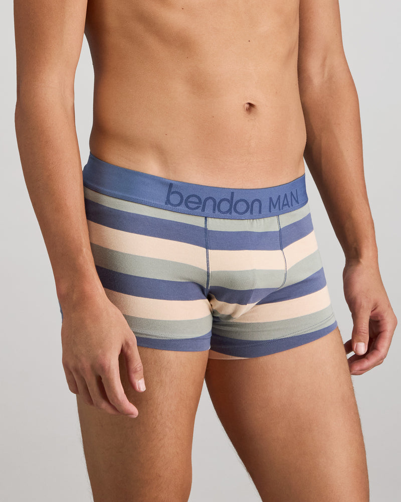 Model wears Rugby Stripe Mens Trunk in INDIGO/ICEBERG/SMOKE. On body side view