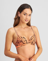 Model wears Uplift Me Push Up Bra in LIVING CORAL LEOPARD PRINT. On body side view