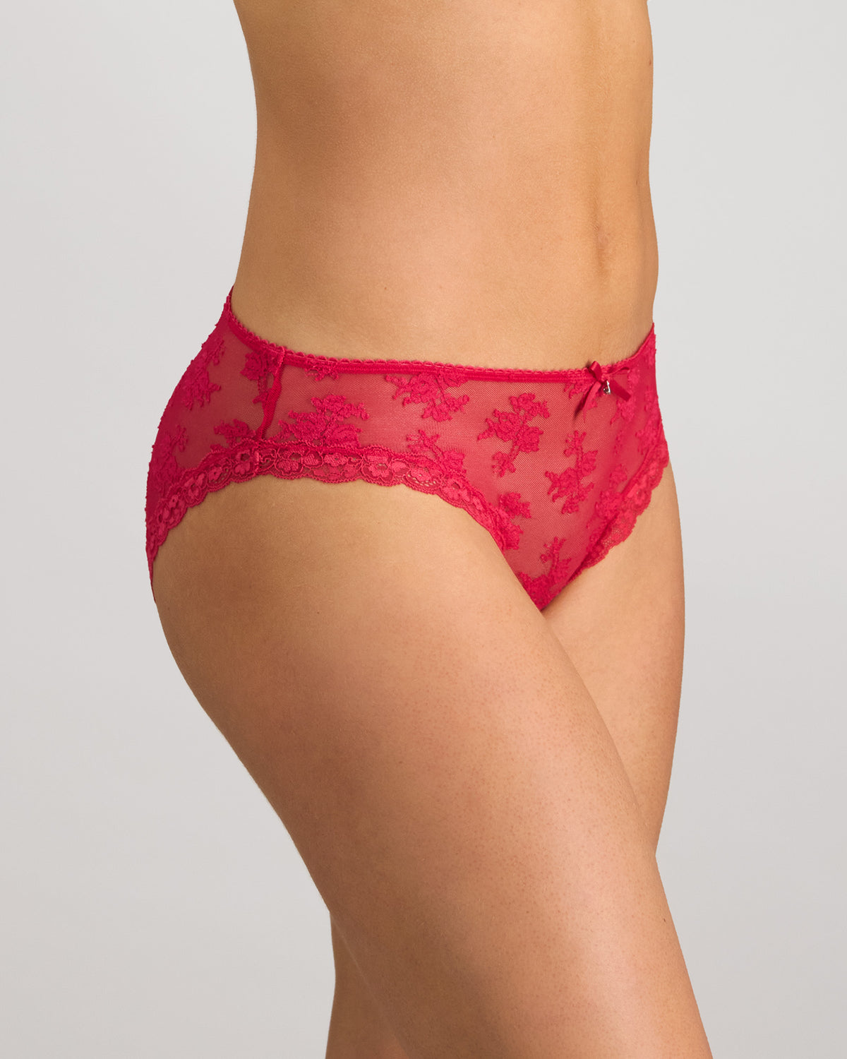 Model wears Light Lace Bikini in JAZZY. On body side view