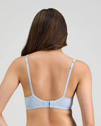 Model wears Yvette Underwire Bra in SKYWAY. On body back view