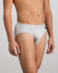 Model wears Bamboo Mens Brief in GREY MARLE. On body side view