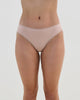 Model wears Stretch Cotton Bikini in LATTE. On body front view