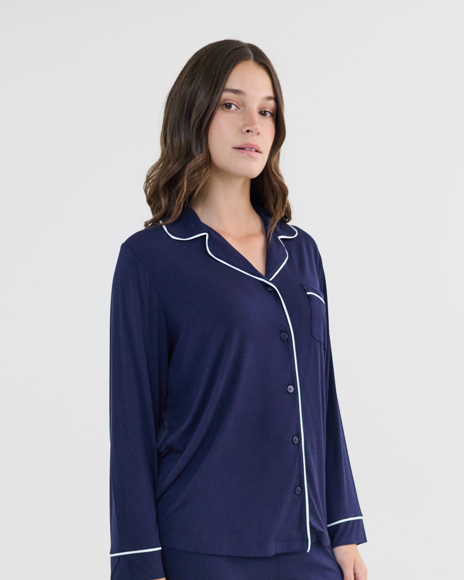 Model wears Bamboo Bliss Long Sleeve PJ Top in NAVY BLAZER. On body side view