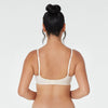 Model wears Yvette Underwire Bra in NATURAL. On body back view