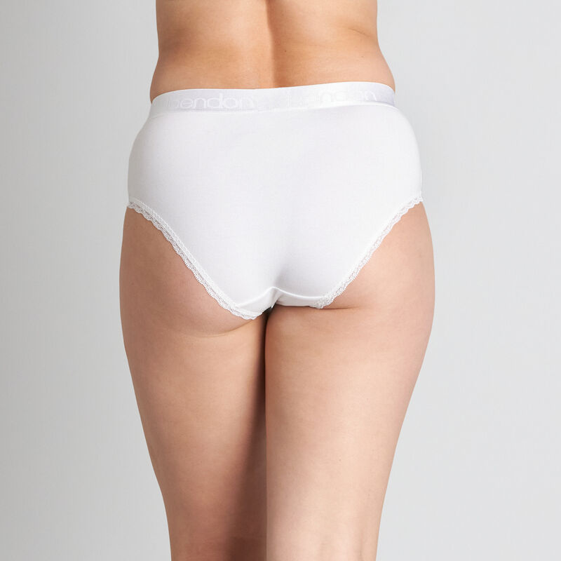 Model wears Cotton Logo Full Brief in WHITE. On body back view