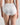 Model wears Freedom Full Brief in WHITE. On body back view