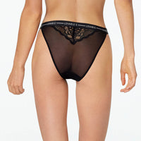 Model wears Sundown High Cut Brief in BLACK. On body back view