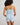 Model wears Smoothie Cami & Short Set in SKYWAY. On body back view