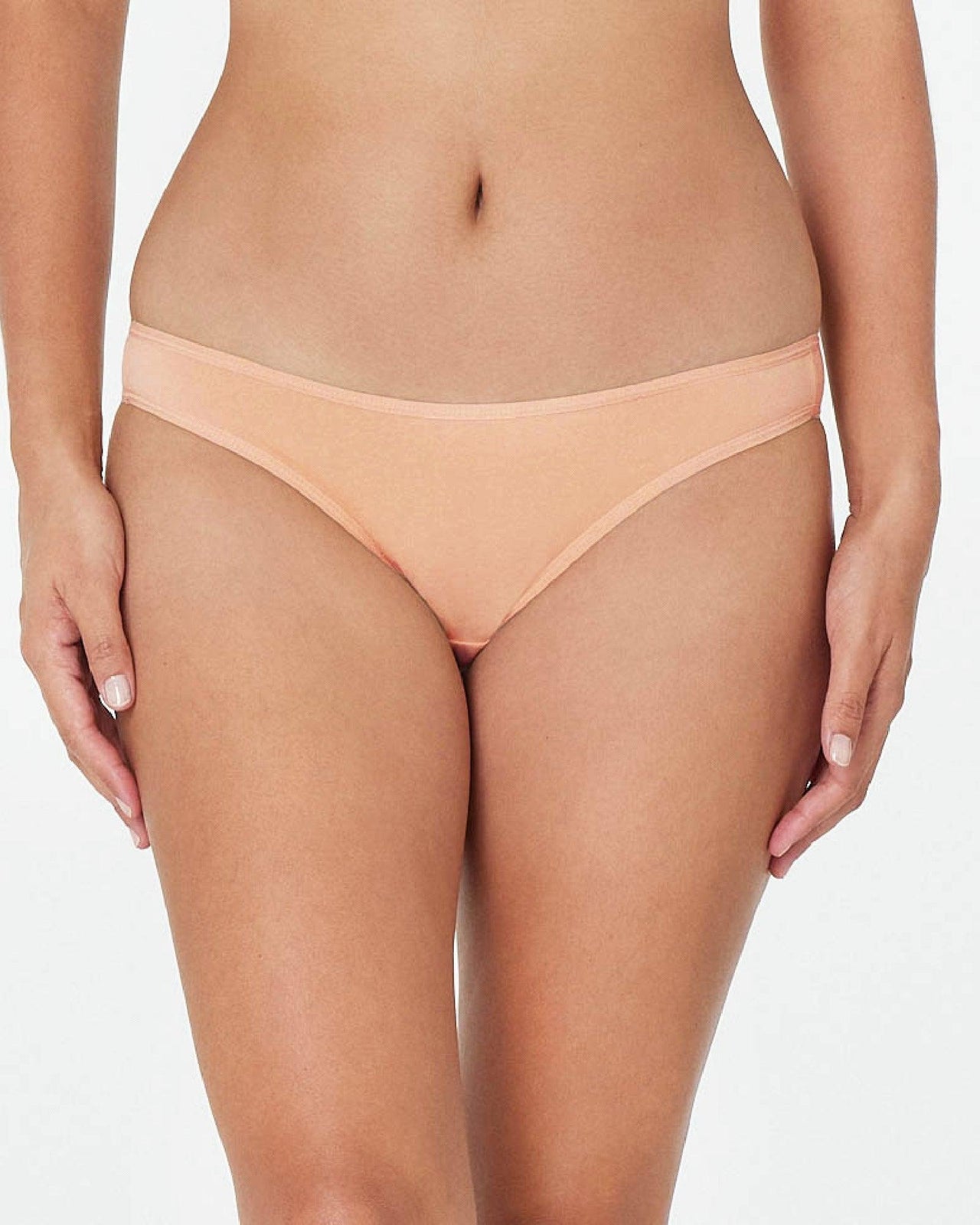 Model wears Clemence Bikini in LATTE. On body front view