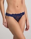 Model wears My Fit Lace Thong in Medieval Blue. On body side view