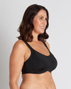Model wears Power Underwire Bra in BLACK. On body side view
