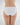 Model wears Embrace Bikini in WHITE. On body back view