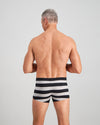Model wears Rugby Stripe Mens Trunk in BLACK RUGBY STRIPE. On body back view