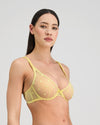 Model wears Sunlit Underwire Bra in LEMON MERINGUE. On body side view