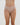 Model wears Lacey Brazilian in LATTE. On body front view