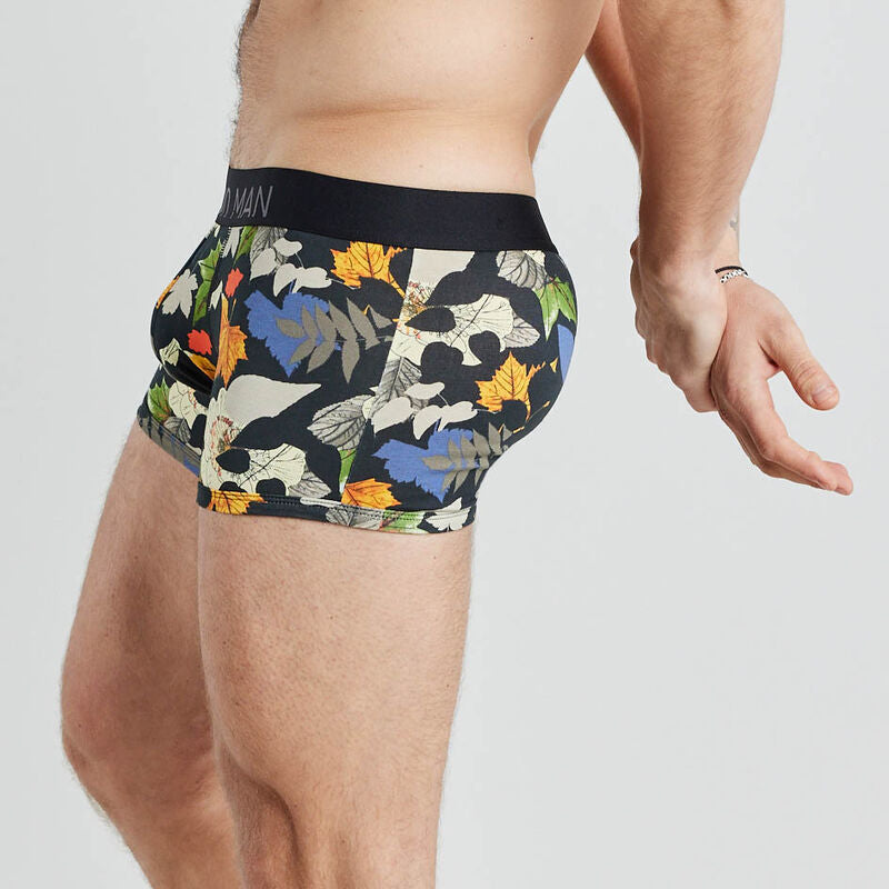 Model wears Retros Print Mens Trunk in SUMMER FOLIAGE PRINT. On body side view