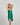 Model wears Evelyn Chemise in ULTRAMARINE GREEN. On body side view