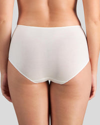 Model wears Au Naturel Full Brief in WHITE. On body back view