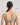 Model wears Power Underwire Bra in ICEBERG GREEN. On body back view