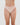 Model wears Seamless Soft Thong in LATTE. On body front view