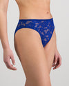 Model wears Leonie High Cut Brief in SURF THE WEB. On body side view