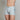 Model wears Cotton Stretch Mens Trunk in BLUE FOG STRIPE. On body side view