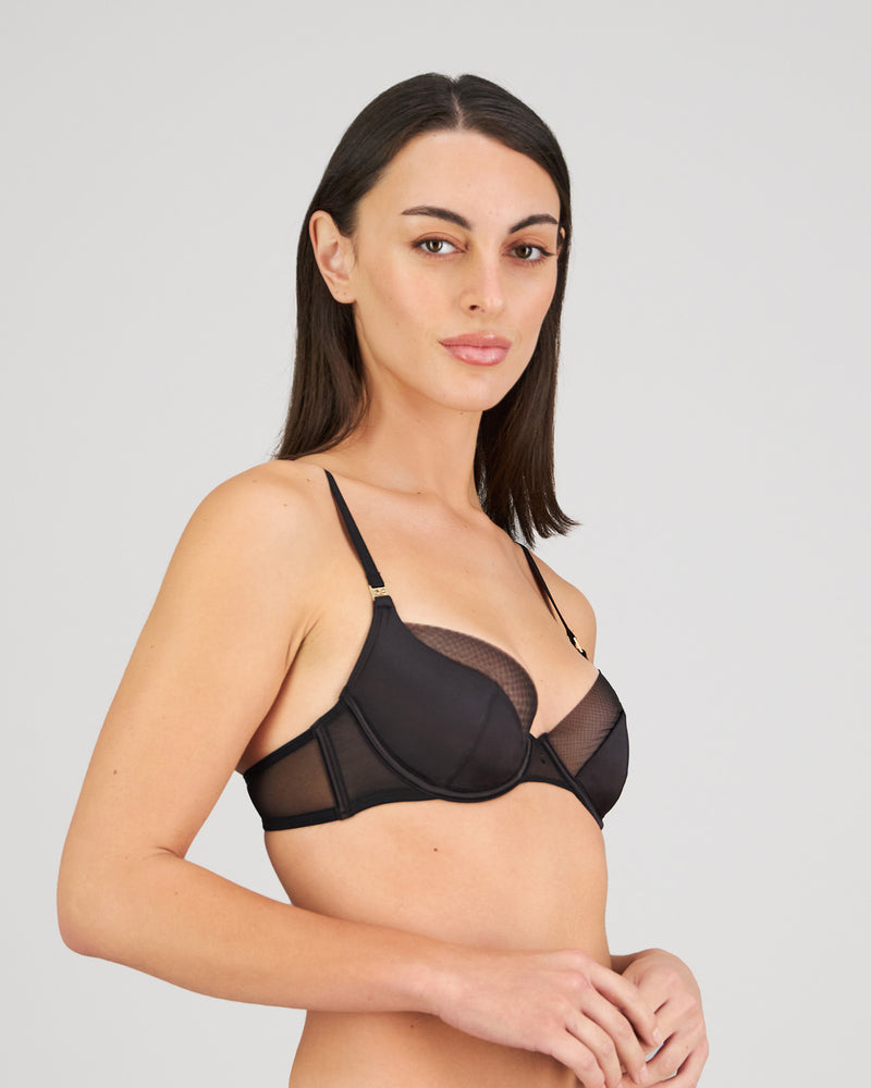 Model wears Sheer Impact Contour Bra in BLACK. On body side view
