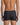 Model wears Cotton Stretch Mens Trunk in BLACK PINSTRIPE. On body back view