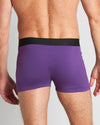 Model wears Everyday Essential Mens Trunk in PURPLE MAGIC. On body back view