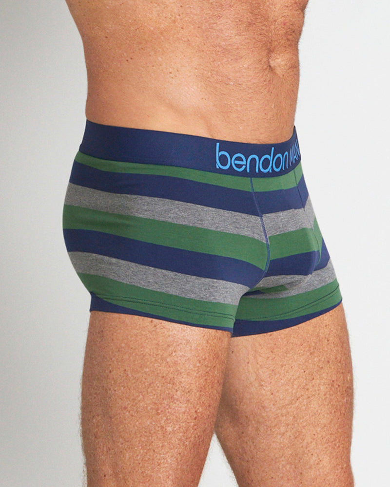 Model wears Rugby Stripe Mens Trunk in FOLIAGE GREEN/MEDEIVAL BLUE/MARLE. On body side view