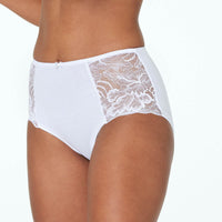 Model wears Embrace Full Brief in WHITE. On body side view