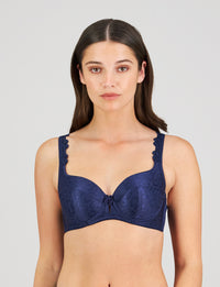 Model wears Damask Contour Bra in Medieval Blue. On body front view