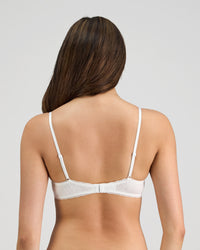 Model wears Body Cocoon Underwire Bra in WHITE. On body back view