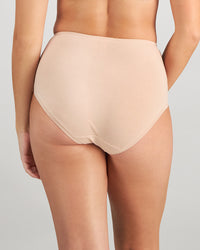 Model wears Embrace Full Brief in LATTE. On body back view